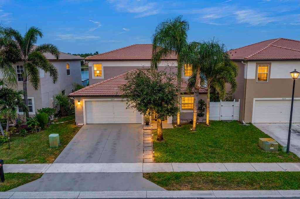 Photo of 6642 Rainwood Cove Lane, Lake Worth, FL 33463 (MLS # B26067231)