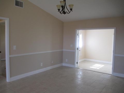 Photo of 2398 SW Susset Lane, Port Saint Lucie, FL 34953 (MLS # B26024716)