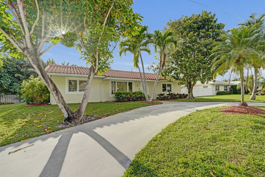 Renovated East Boca corner lot home with no HOA. Ideally located in a prime East Boca location just minutes from the beach, Mizner Park, Town Center, FAU, and Downtown Delray. This 4-bedroom, 2-bath, 1-car attached garage residence features a bright, open layout and modern updates throughout, including custom zebra blinds throughout, new cabinetry in the kitchen and closets, under-cabinet kitchen lighting, and a dual-drawer dishwasher. Enjoy a private pool and spa, professionally installed low-maintenance artificial turf, and a lush landscaped yard with mature fruit trees including avocado and mango. None
