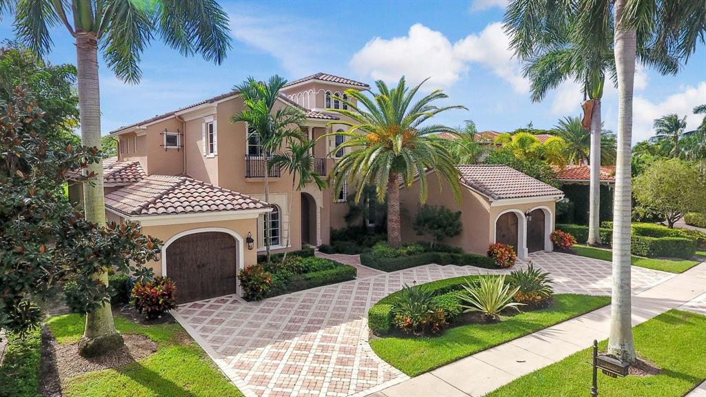 This spectacular home is located on Talavera, one of Mirasol's finest and most desirable neighborhoods in close proximity to the Club. Exquisite arched glass and wood doors greet you upon entry to the beautiful living room adorned with stone fireplace and full service bar for entertaining. Floor to ceiling windows allow natural ambient light to fill the living spaces bringing out the neutral tones of the transitional architecture. The magnificent kitchen design is one of the nicest of any home in Mirasol and the perfect place for both the chef and host to work their magic. An enormous 12' long center island and an impressive 15' granite counter can accommodate up to eight bar stools and will be the center piece of every party