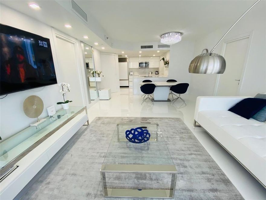 Beautifully renovated 2-bed 2-bath residence in the highly sought-after Ocean Four in Sunny Isles Beach. This bright and spacious home features floor-to-ceiling windows, a generous split-floorplan, and a large private balcony  city views. Modern finishes, fresh design, high-quality materials throughout. The open kitchen is equipped with premium Sub-Zero and Miele appliances, granite countertops. Master bed includes a large walk-in closet and bathroom with a tub and separate glass shower. The second bedroom is equally spacious and has its own bathroom. WasherDryer inside unit. One assigned parking +1 Valet. Ocean Four is an oceanfront, full-amenity condominium offering 24/7 concierge and valet, a resort-style pool, private beach service, café, fitness center, spa, and direct beach access.