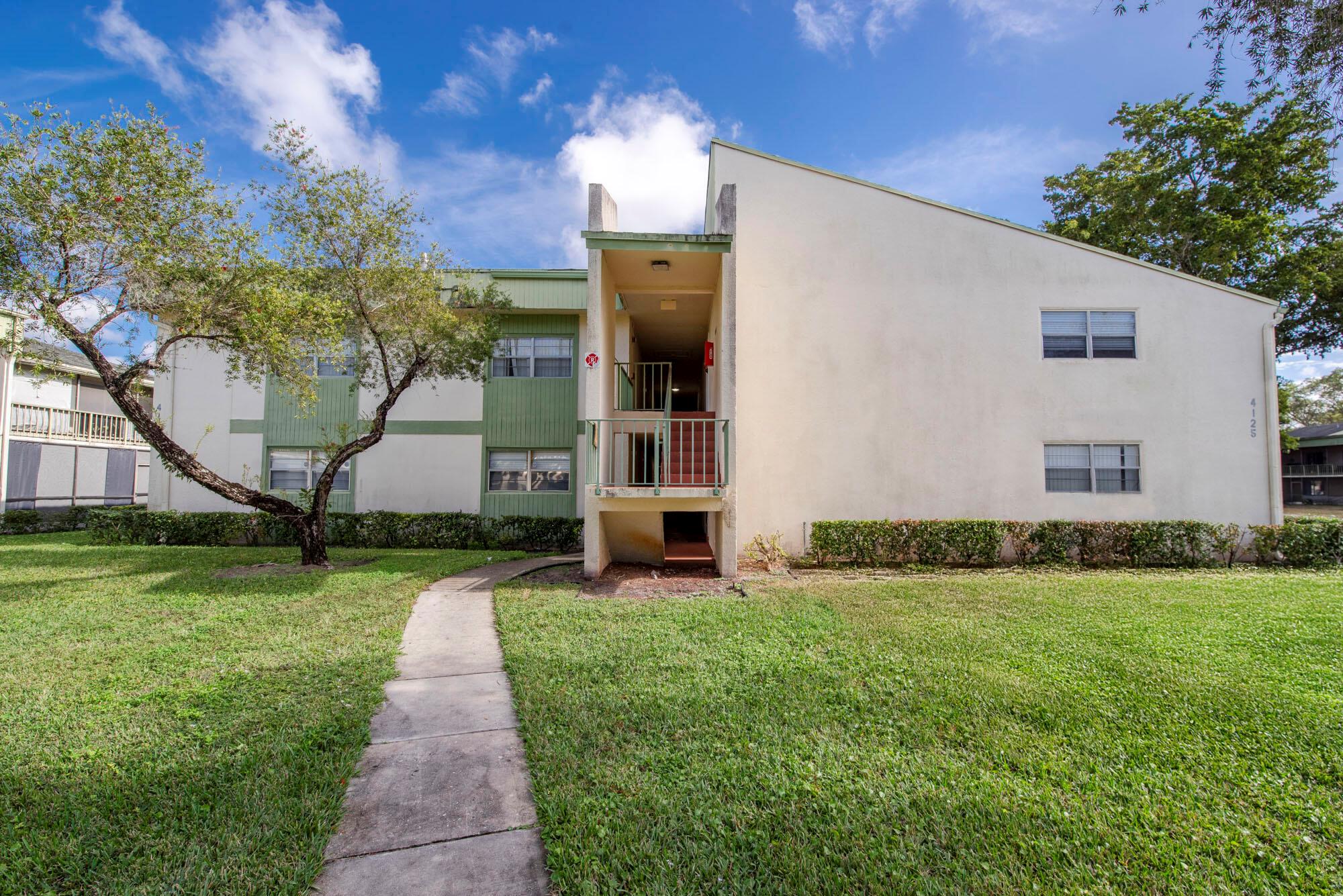 Spacious and modern condo in Ramblewood East, Coral Springs! This open-plan home features sleek tile flooring, updated kitchen with granite countertops, stainless steel appliances, and custom cabinetry. The living area is bright and airy, with large sliding doors leading to a covered balcony with tranquil green views. The primary suite offers a built-in closet and en-suite bathroom with contemporary finishes. Additional perks include abundant natural light, stylish lighting, and access to the community pool, clubhouse, and fitness center. Conveniently located near top-rated schools, parks, shopping, and dining, this home combines comfort and convenience in a serene setting.