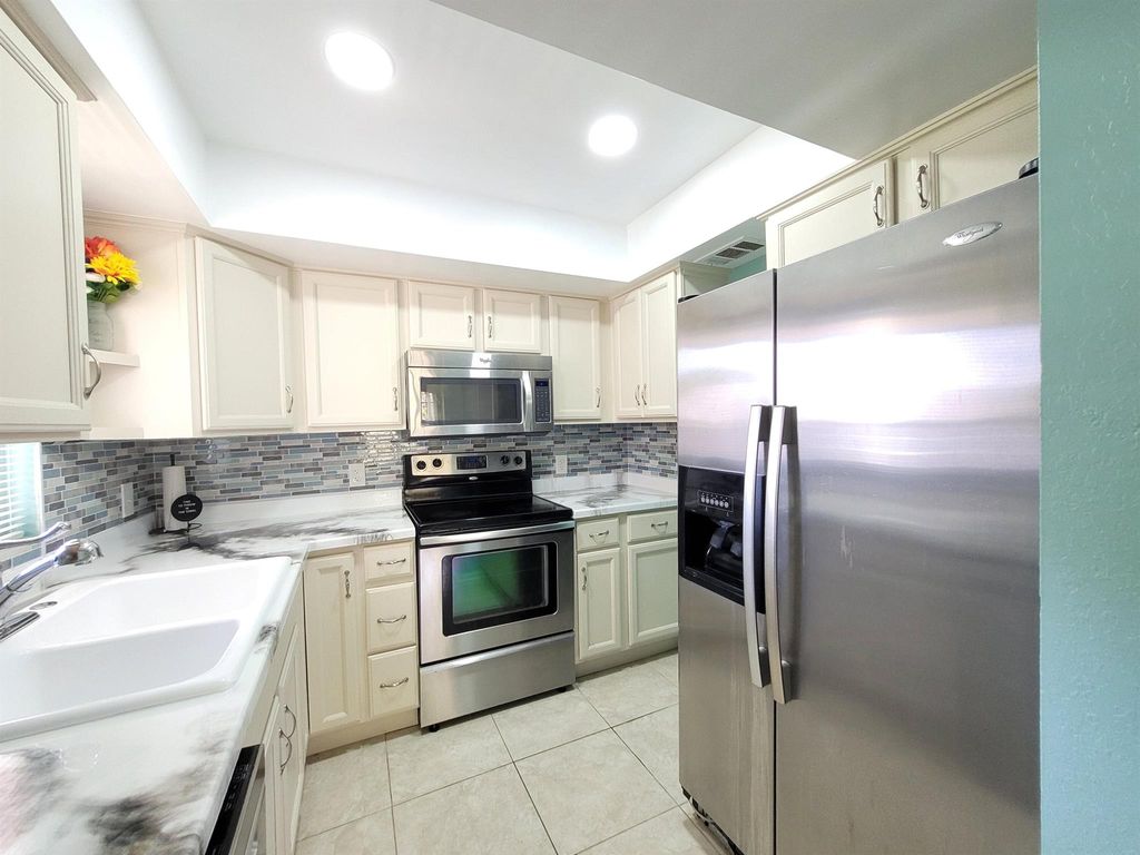 Photo of 1679 SE Green Acres Circle #202, Port St Lucie, FL 34952 (MLS # R10917486)