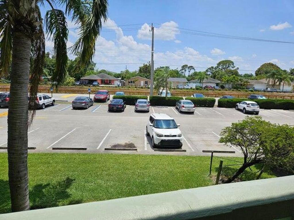 Photo of 300 Village Green Circle S #209, Palm Springs, FL 33461 (MLS # R11159794)