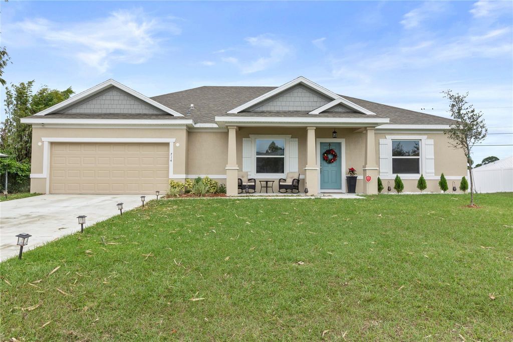 Photo of 714 SW Tupper Lane, Port Saint Lucie, FL 34953 (MLS # F10414125)