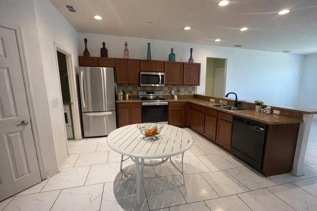 Photo of 1003 Mystery Circle, Davenport, FL 33837 (MLS # B26015450)