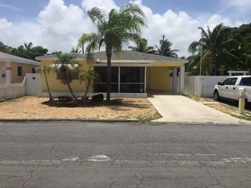 Cute 2/2 ranch style home in Lake Worth, Florida room can be used as a 3rd bedroom. Property is less than 1 mile to intracoastal and less than 1.5 mile to the beach.  AC and duct work 2 years old, water heater 2 years old.  carpet, hard wood and tile floors.  Screened in patio, covered carport. Seller is going to replace electrically panel. Great single family home or investment property.