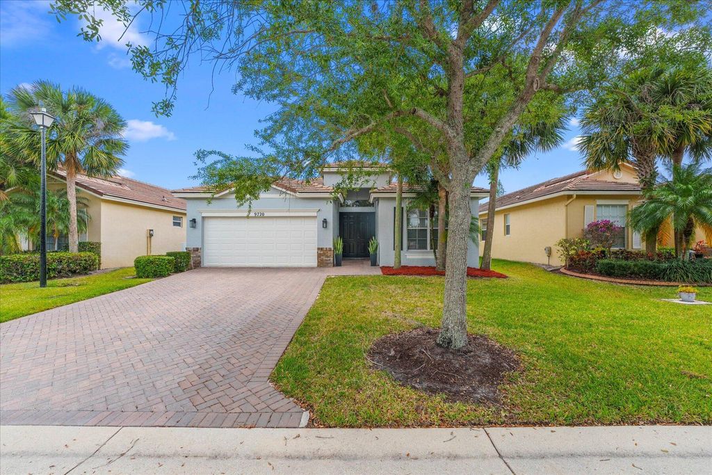 Photo of 9720 SW Lindale Boulevard SW, Port Saint Lucie, FL 34987 (MLS # R10984003)