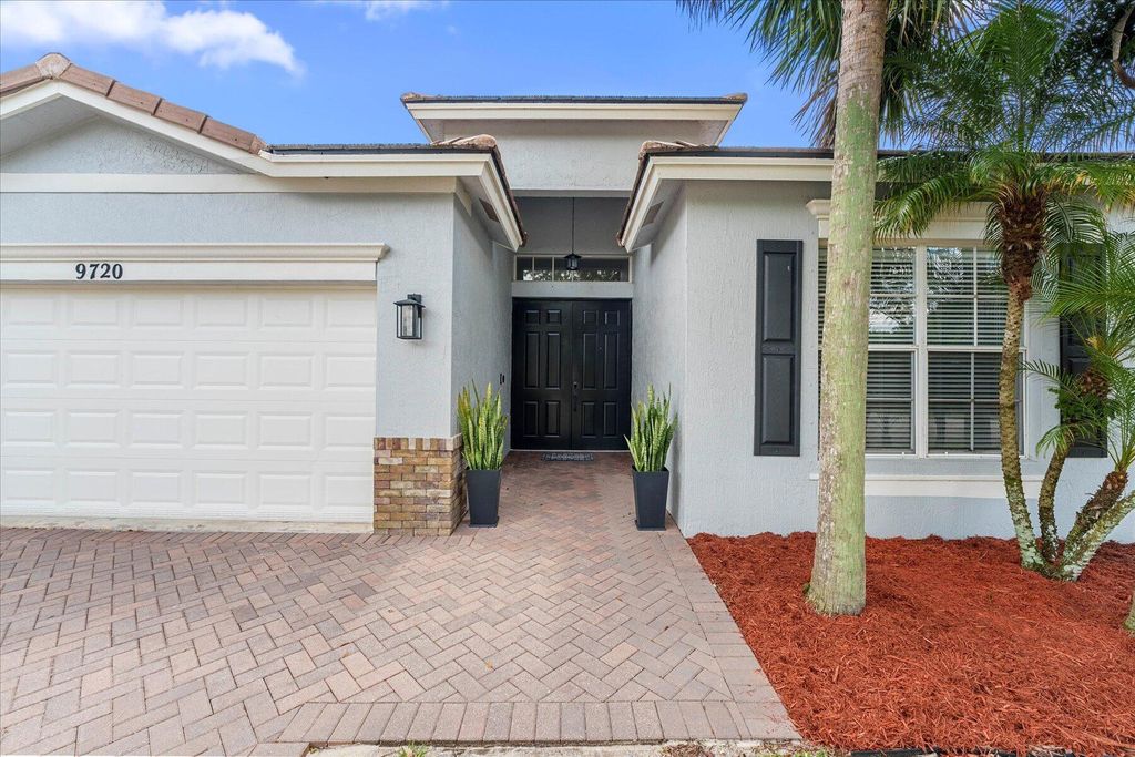 Photo of 9720 SW Lindale Boulevard SW, Port Saint Lucie, FL 34987 (MLS # R10984003)
