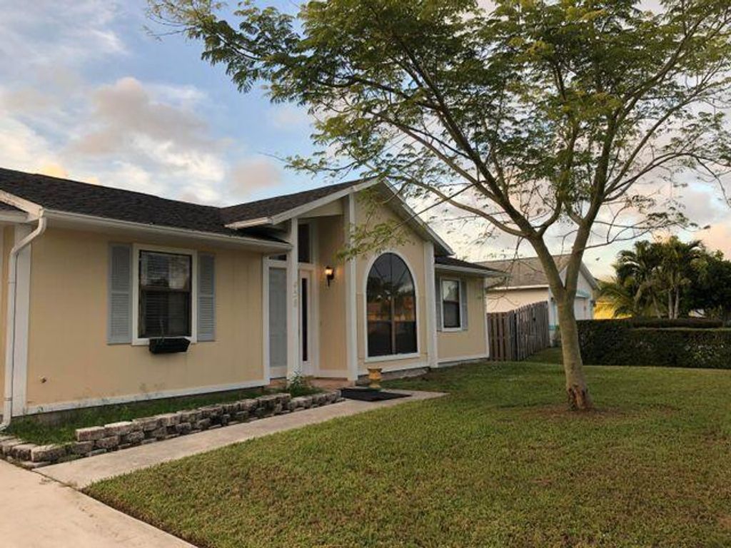 Photo of 458 SE Cork Road, Port Saint Lucie, FL 34984 (MLS # R10758221)