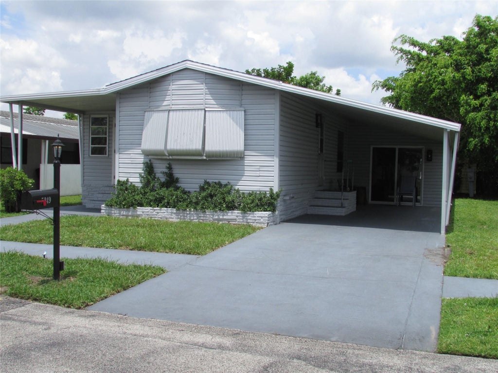 Photo of 5249 NW 4TH Terrace, Deerfield Beach, FL 33064 (MLS # B26081970)