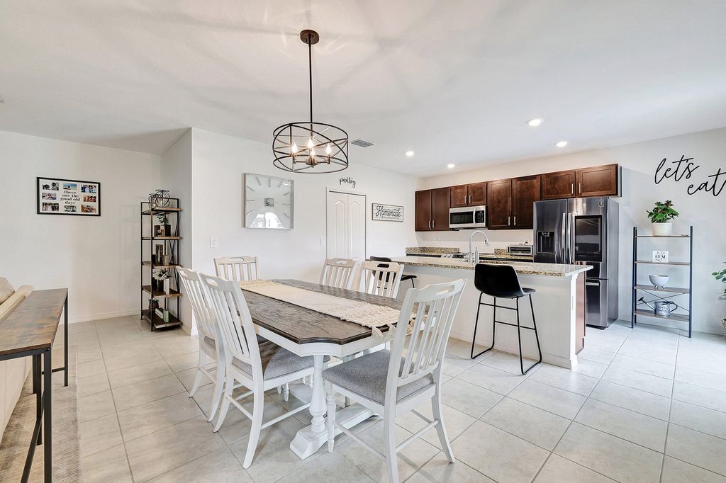 Photo of 3725 SW Kasin Street, Port Saint Lucie, FL 34953 (MLS # R10973098)