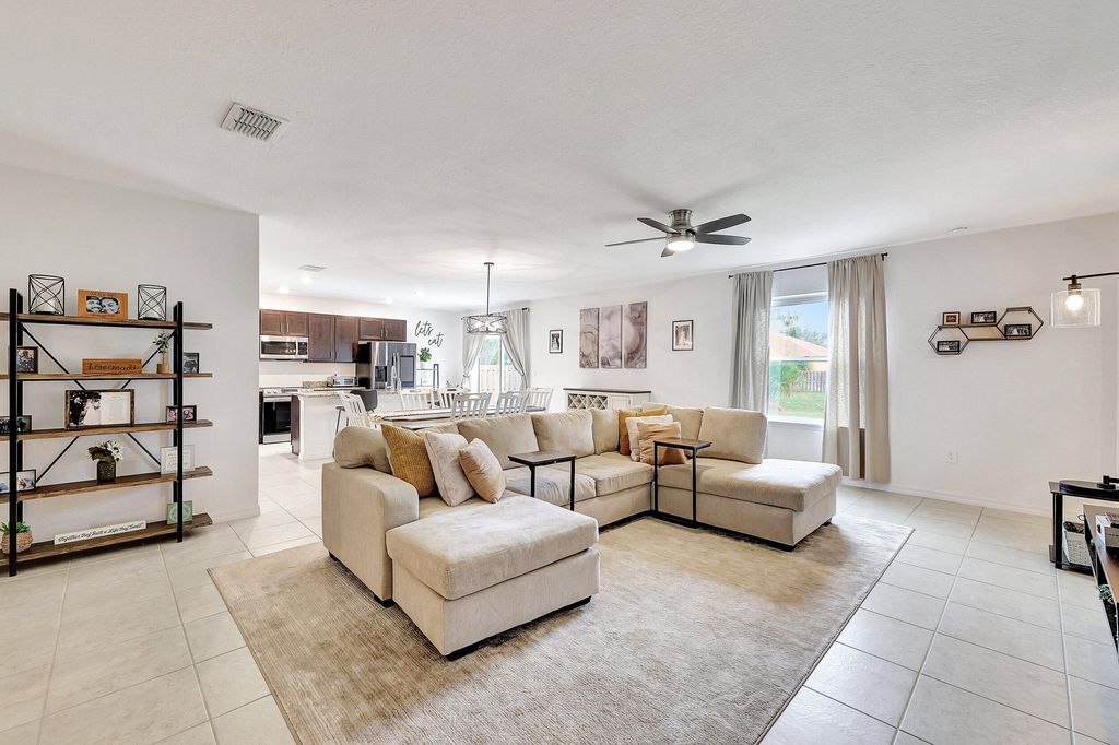 Photo of 3725 SW Kasin Street, Port Saint Lucie, FL 34953 (MLS # R10973098)