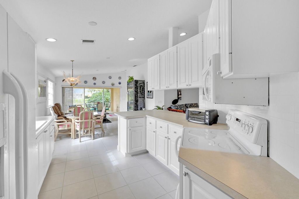 Photo of 5041 Magnolia Bay Circle, Palm Beach Gardens, FL 33418 (MLS # R10961602)