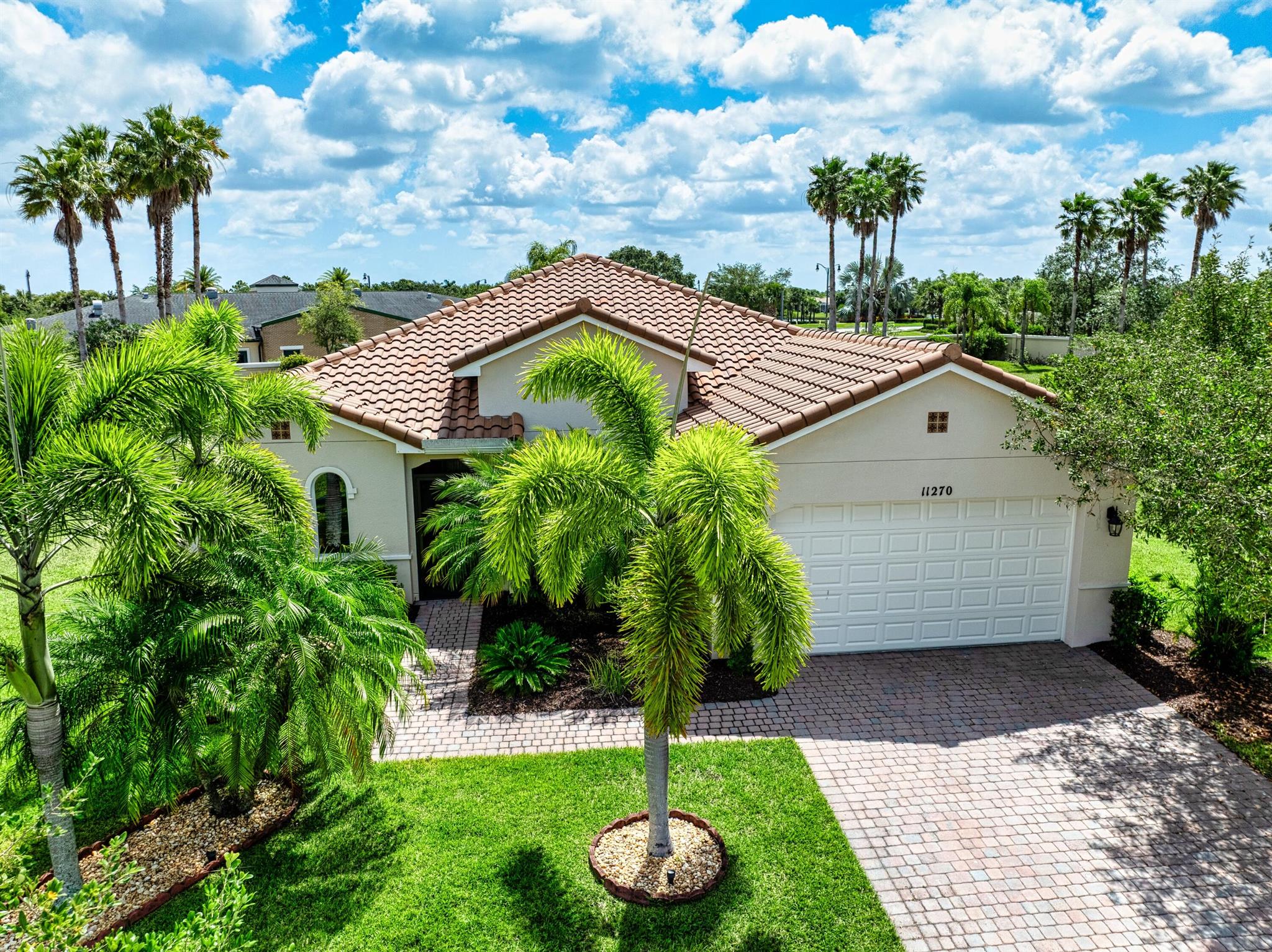 This stunning 3-bedroom, 3-bathroom home with a spacious den offers the perfect blend of indoor comfort and outdoor luxury, all set on one of the largest pie-shaped lots in the community. The showpiece of the property is the expansive lanai, featuring a remote-controlled storm shade and elegant travertine flooring, which frames a spectacular saltwater heated pool--your own private retreat designed for year-round enjoyment and entertaining. Inside, the home boasts just under 2,300 square feet of thoughtfully designed living space with a bright and open layout. The large kitchen, dining, and living area flow seamlessly together, centered around a massive kitchen island that's perfect for gathering. A chef's dream, the kitchen is equipped with 42-inch cabinets, a natural gas range,