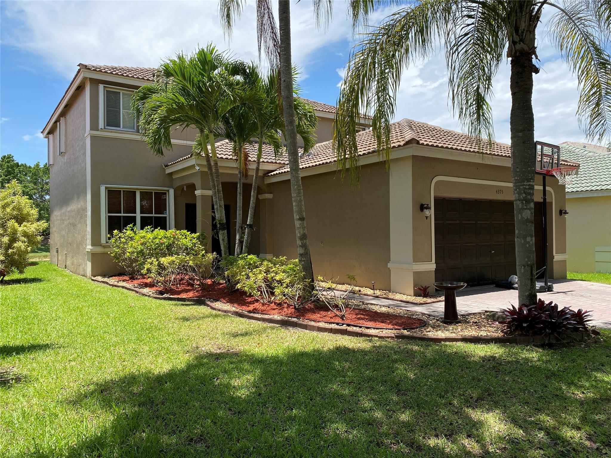 Cozy 4Bed+den, 2.5bath lakefront home in the highly desirable gated community of The Ridges w. A-rated schools. Contemporary kitchen features quartz countertops, SS appliances, pull-out faucet, deep square dual-sink & wine cooler. Travertine flooring throughout the 1st floor. Luxury Wood-grain Vinyl Floors in all bedrooms upstairs. Remodeled master suite has his/her closets, dual-sink vanity, accent decor lighting, separate tub/shower, & high-end accessories. Covered patio is great for relaxing/gatherings. 2-car garage w. remote control. Extra storage under the stairs. Accordion shutters offer quick hurricane protection. Community offers pools, tennis/basketball/volleyball courts, picnic BBQ areas. Easy access to I-75 & I-595. Closed to library, shopping plazas, and international airports.