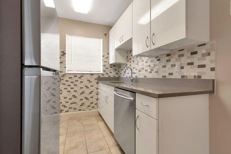 Welcome to this beautiful updated 1 bedroom, 1 bathroom condominium in Downtown Lake Worth Beach.Your water bill is included in the rent... steps to shops and restaurants the revitalized Gulfstream coming soon!