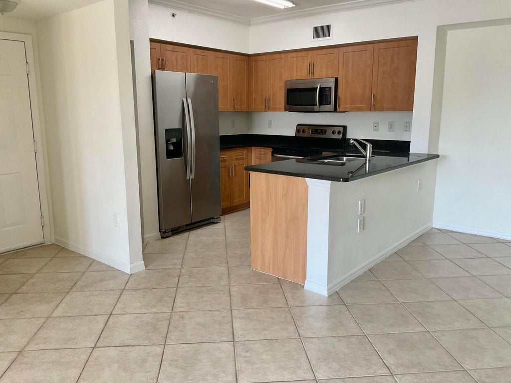 Photo of 6466 Emerald Dunes Drive #304, West Palm Beach, FL 33411 (MLS # R11071630)