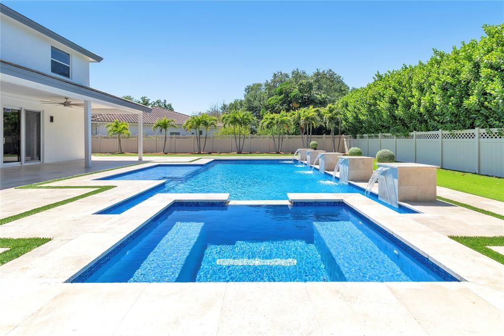NO HOA! Stunning 4and half Bedroom, 3.5-Bath Estate with 3-Car Garage
Tucked away on a peaceful cul-de-sac, this meticulously crafted estate offers elegance, comfort, and privacy with no HOA restrictions. Featuring 4 to 5 spacious bedrooms and 3.5 luxurious baths, this home showcases superior craftsmanship and thoughtful design throughout.
Enjoy an expansive open-concept layout, highlighted by a state-of-the-art gourmet kitchen built to impress. Custom finishes, LED lighting, and high-end details lend a sense of refined sophistication to every room.
New hurricane-impact windows provide safety and energy efficiency, while the lushly landscaped backyard offers a true private retreat. Relax or entertain in the resort-style pool area with a generous covered patio.