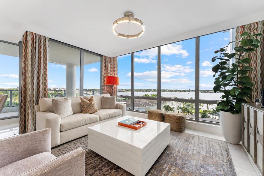 FULLY FURNISHED designer residence at Water Club with breathtaking panoramic water views. Floor-to-ceiling glass fills the home with natural light, while a private elevator entry provides comfort and privacy. Offering 2 bedrooms, 2.5 baths and a designated office/den, this is an ideal turnkey, lock-and-leave residence. Two private balconies - one east for water and sunrise views, one west for sunset skies. One of Palm Beach County's most prestigious waterfront communities, amenities include 24/7 concierge and manned gate, private marina with resident day dock, three pools, two hot tubs, two fitness centers, locker rooms with steam and sauna, beach cabanas, club room, pickleball court, dog park, and resident hotel suites. Pet friendly - up to three pets and no size restrictions. Located minutes from the area's best restaurants, GOLF and shopping. Easy access to I-95 and FL Trnpk, PBI Airport, Palm Beach, West Palm and Jupiter. TRULY SPECTACULAR VIEWS!