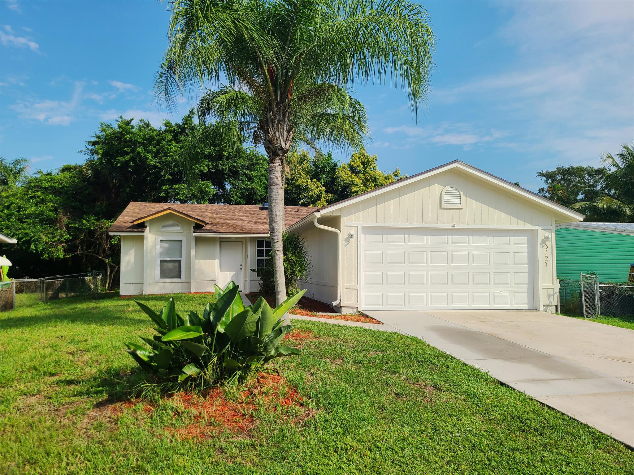 NEW ROOF, NEW INTERIOR AND EXTERIOR PAINT, NEW CARPET, MOVE-IN-READY! Welcome to this 3-bedroom, 2-bathroom home located in South Stuart. With a thoughtfully designed split floor plan, this home offers both functionality and comfort. The kitchen has a pass through area letting you interact with those in the living room and the living room seamlessly flows into the dining area, creating a perfect space for family meals and entertaining. Just off the dining area, the patio provides a private outdoor retreat, ideal for relaxing or hosting gatherings. 2022 HVAC and 2024 HWH. The property must be listed in the MLS system for a minimum of 7 calendar days before any offer is negotiated or accepted. Don't miss the opportunity to make this delightful property yours. Schedule your showing today!
