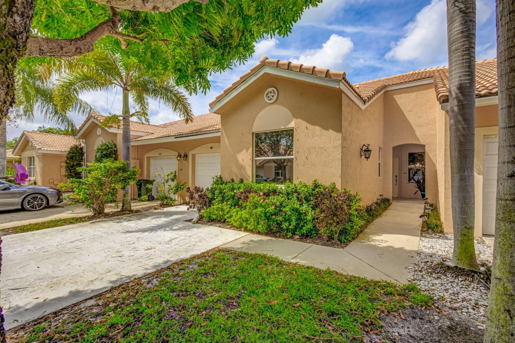 Photo of 386 Coral Trace Lane, Delray Beach, FL 33445 (MLS # R11057903)