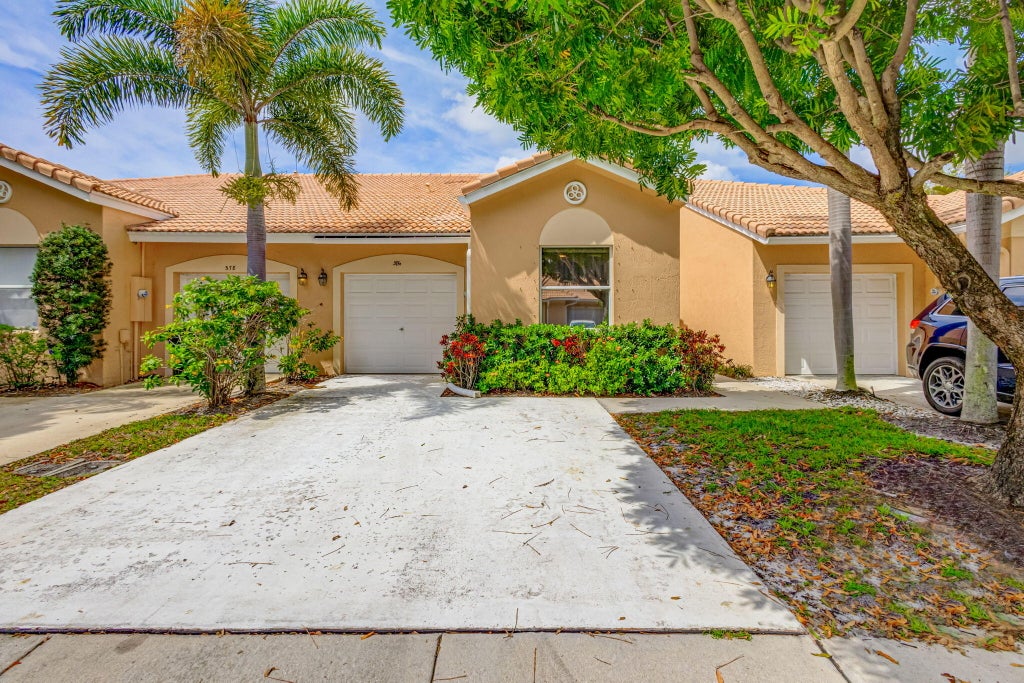 Photo of 386 Coral Trace Lane, Delray Beach, FL 33445 (MLS # R11057903)