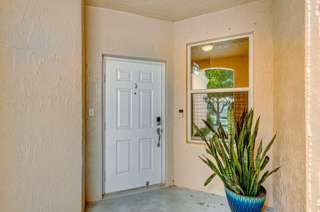 Photo of 386 Coral Trace Lane, Delray Beach, FL 33445 (MLS # R11057903)