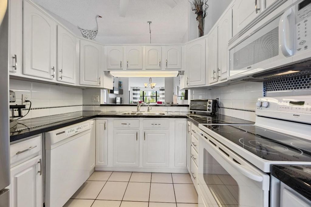 Photo of 7673 Tahiti Lane #203, Lake Worth, FL 33467 (MLS # R11155687)