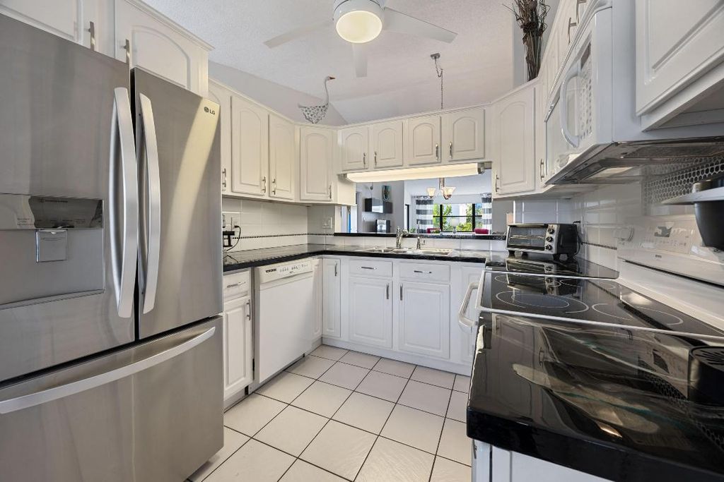 Photo of 7673 Tahiti Lane #203, Lake Worth, FL 33467 (MLS # R11155687)