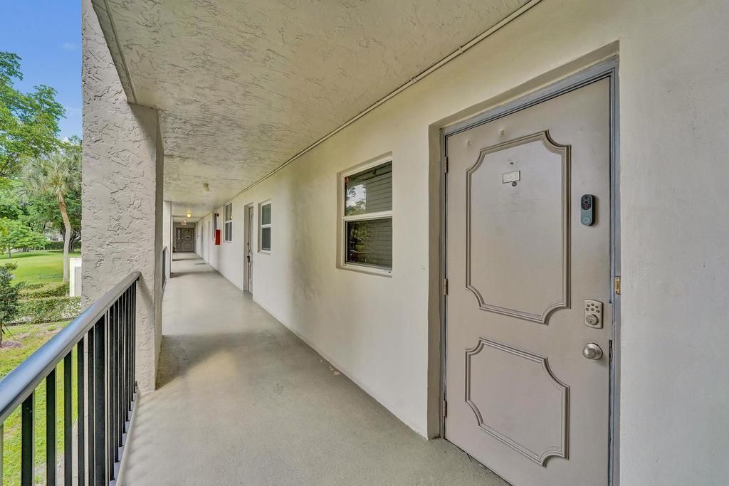 Photo of 9480 Poinciana Place, Davie, FL 33324 (MLS # B26005147)