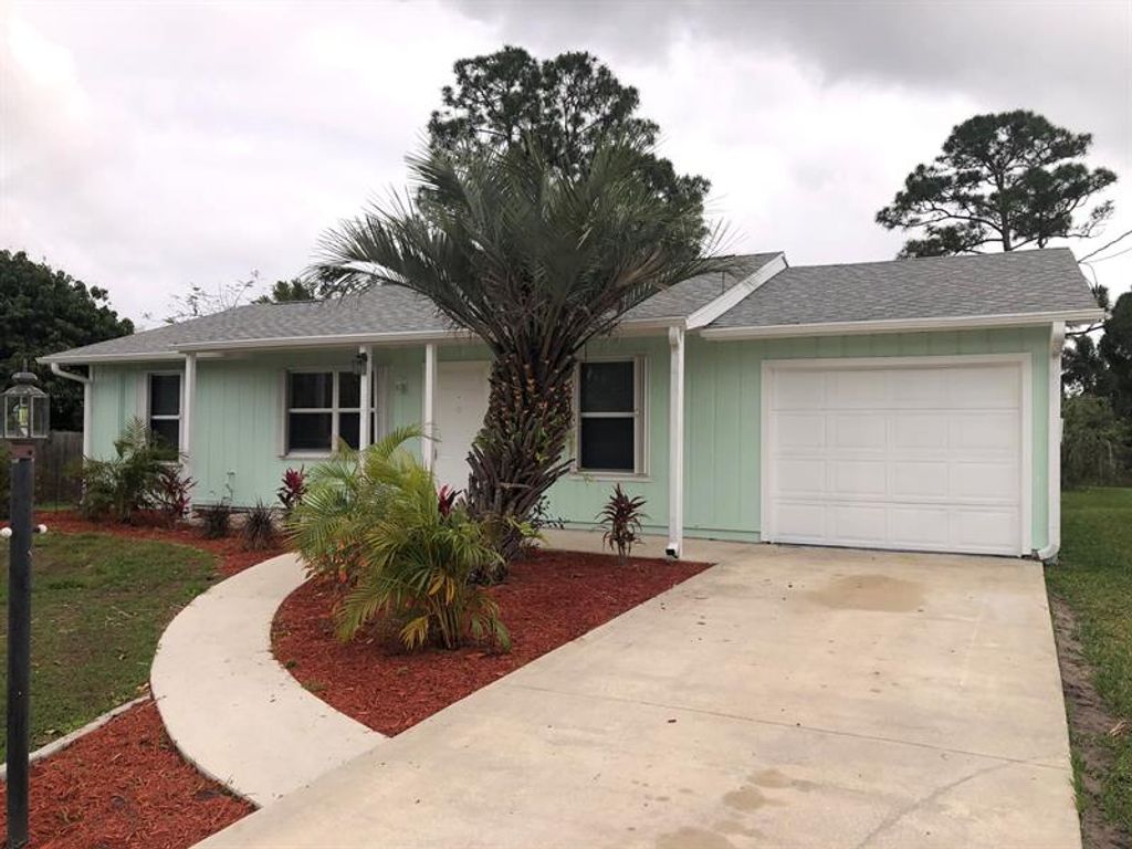 Photo of 1226 SW Fountain Avenue, Port Saint Lucie, FL 34953 (MLS # R10709256)
