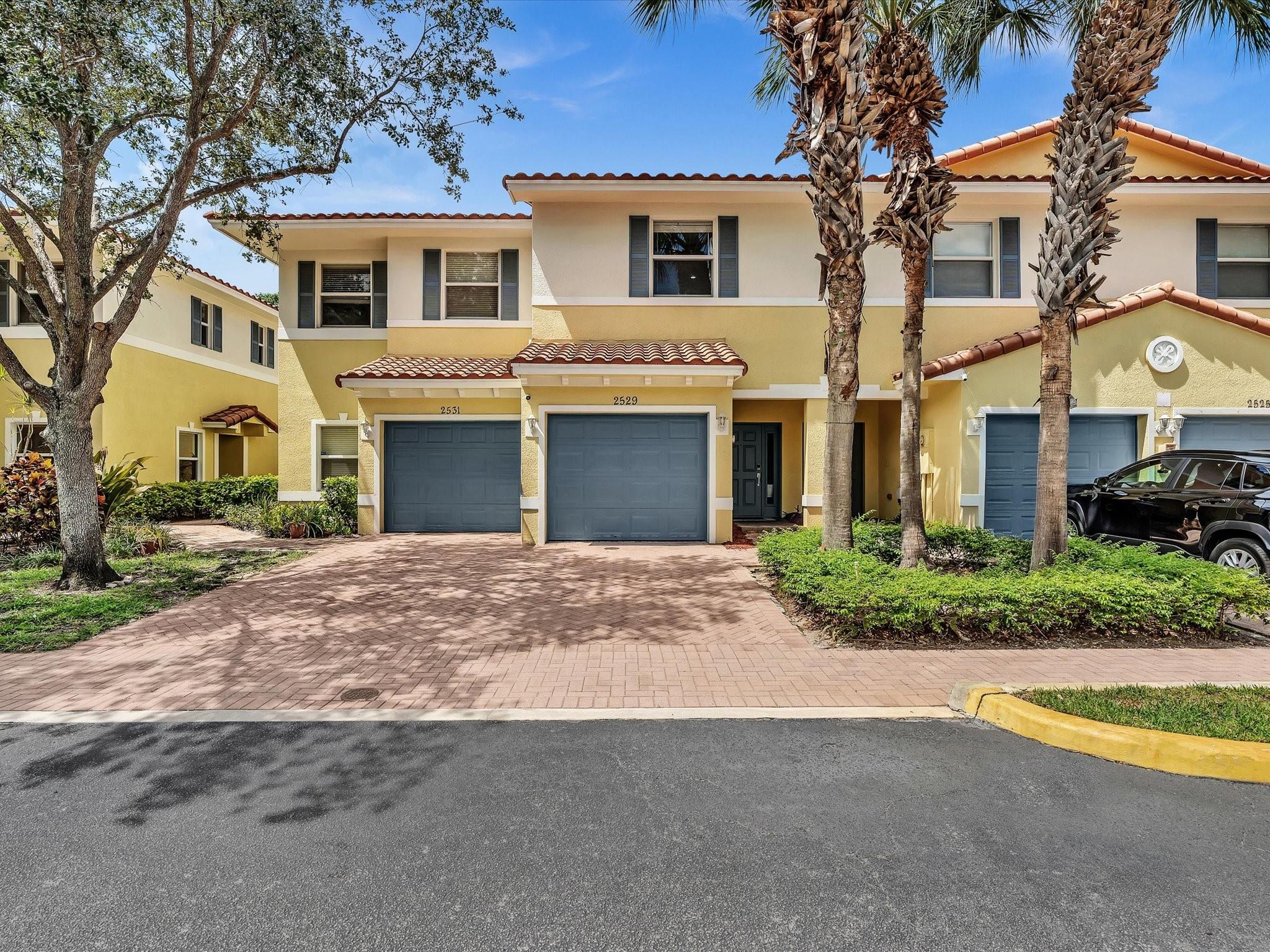 Substantially updated with style and quality, this town home is move in ready! Enjoy the serene back patio with just green and flowers to see. With its open concept, this home feels open and airy. Almost all appliances, flooring, and the kitchen is updated and newer. Ample parking is featured with both a garage, driveway, and guest parking. Full size washer and dryer is located upstairs for ease of doing laundry. The upstairs features the bedrooms split at opposite ends of the hall so everyone gets quiet and privacy. Plenty of closet space and abundant storage here! Great location with easy access to major roads, grocery stores, shops, restaurants, Wilton Manors, and the beaches just off Oakland Park Blvd. The gated complex offers security, a heated pool, and a quiet well kept community.