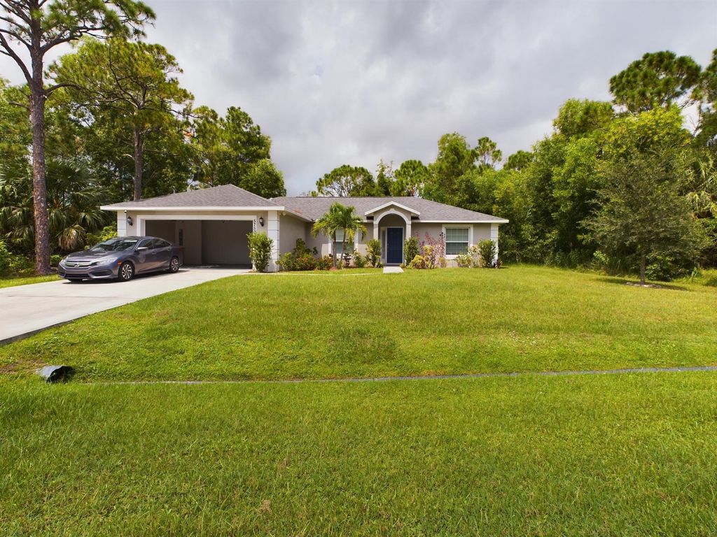 Photo of 5750 NW Zenith Drive, Port St Lucie, FL 34986 (MLS # R10992537)