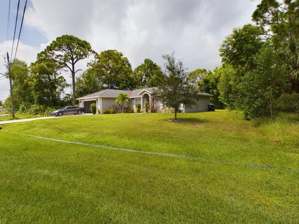 Photo of 5750 NW Zenith Drive, Port Saint Lucie, FL 34986 (MLS # R10992537)