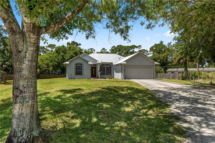 WEST- FORT PIERCE, RARELY AVAILABLE, HOME ON ALMOST 1/2 ACRE IN DESIREABLE LOCATION. 1 MILE FROM I-95 AND EASY COMMUTE TO FLORIDA TURNPIKE. HOME FEATURES CBS CONSTRUCTION, 2021 METAL ROOF, NEW ALUMINUM GUTTERS. 3 BEDROOM, 2 BATH, 2 CAR GARAGE. NEWLY PAINTED EXTERIOR AND INTERIOR. OPEN KITCHEN WITH AN ABUNDANCE OF NATURAL LIGHT OVERLOOKING YOUR PEACEFUL BACK YARD. NEWLY RENOVATED MASTER SUITE WITH WALK-IN CLOSET, DOUBLE VANITIES AND OVERSIZED SHOWER. ENJOY YOUR SPACIOUS PORCH WITH TONGUE AND GROOVE CEILING, 2019 ROOF AND UPGRADED FLOORING. PROPERTY OFFERS PLENTY OF ROOM FOR R/V AND BOAT PARKING, LARGE PRIVATE BACK YARD WITH BEAUTIFUL MATURE OAKS, PERIMETER FENCING AND ROOM FOR A POOL. A TRUE GEM- MUST SEE!