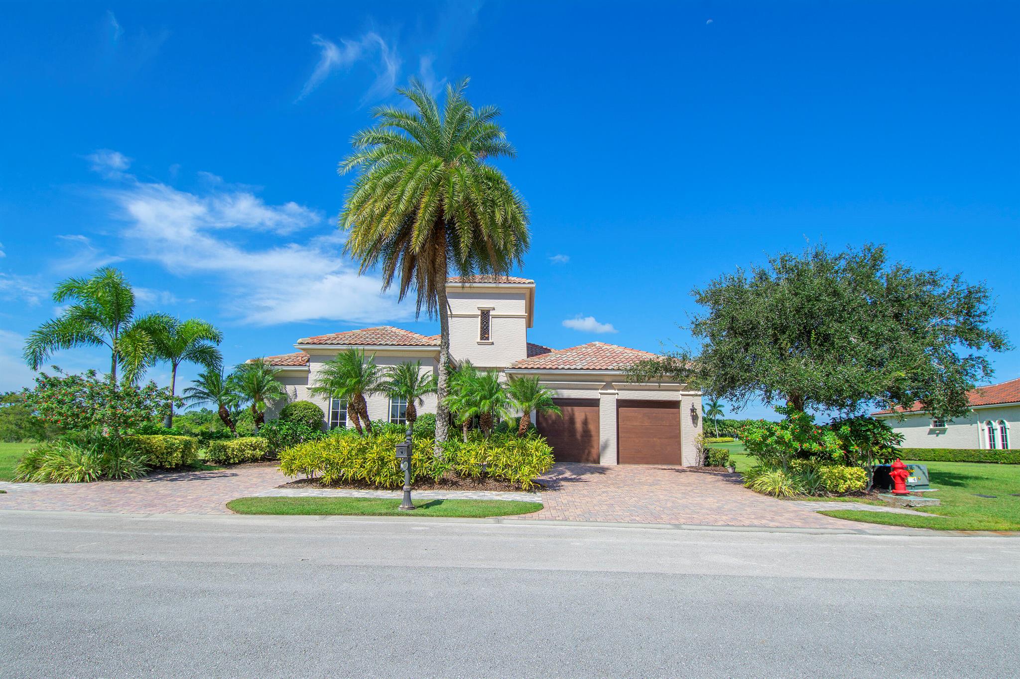 Experience privacy in this newly painted fully furnished Tuscan-style home. The 37ft. long covered porch overlooks a newly resurfaced lap pool with a hot tub & features an outdoor kitchen with a natural gas grill; the fire pit has views of a preserve, 16th fairway & pond. 5 double French doors lead from the porch into the Great room & kitchen. The refinished marble floors accent all the indoor entertainment areas. The private office/den has wood floors. Each Bedroom with ensuite baths, designed for maximum privacy, has been updated with new carpets. The Main Bedroom suite has a 14 ft high tray ceiling, both his & her private baths, and 2 walk-in closets featuring custom cabinets. Updated AC's, New pool heater, Tankless water heater, EV Car & Golf Cart charger, 400 amp electric service