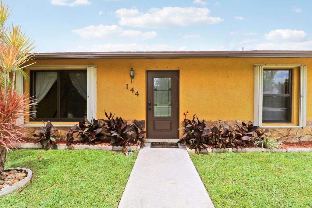 Photo of 144 Bilbao Street, Royal Palm Beach, FL 33411 (MLS # B26025417)