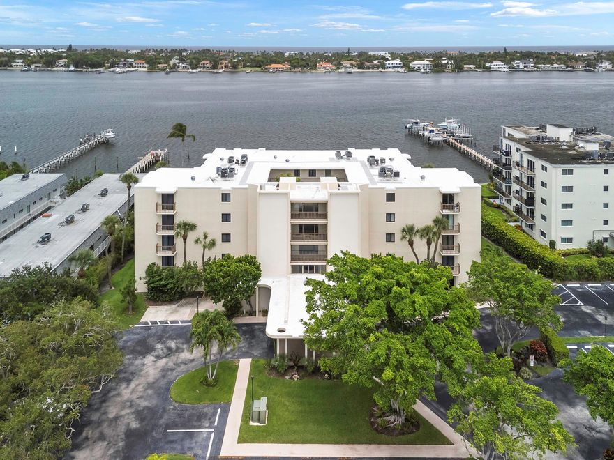 Discover the convenience and comfort of this rare first-floor 2-bedroom, 2-bathroom condo in the boutique Hidden Banyan community. Step directly inside from your private patio entrance, where you'll enjoy serene views of the heated waterfront pool and Intracoastal Waterway--all just steps from your dedicated parking space. The renovated kitchen features 42'' cabinetry, granite countertops, and stainless steel appliances, offering both style and functionality. Both bathrooms have been tastefully updated, and the spacious bedrooms include a walk-in closet for added storage. Recent upgrades include a 10-year-old AC system and a new roof (2025) HOA fees cover water, sewer, trash, basic cable, pool maintenance, landscaping, and building insurancewith no assessments. More...