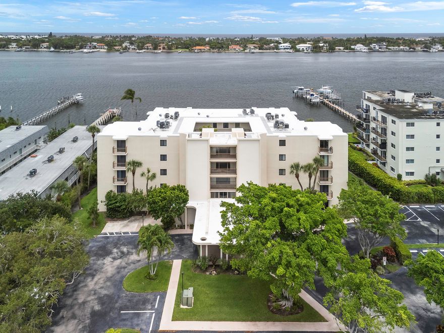Discover the convenience and comfort of this rare first-floor 2-bedroom, 2-bathroom condo in the boutique Hidden Banyan community. Step directly inside from your private patio entrance, where you'll enjoy serene views of the heated waterfront pool and Intracoastal Waterway—all just steps from your dedicated parking space. The renovated kitchen features 42'' cabinetry, granite countertops, and stainless steel appliances, offering both style and functionality. Both bathrooms have been tastefully updated, and the spacious bedrooms include a walk-in closet for added storage. Recent upgrades include a 10-year-old AC system and a new roof (2025) HOA fees cover water, sewer, trash, basic cable, pool maintenance, landscaping, and building insurancewith no assessments. More...