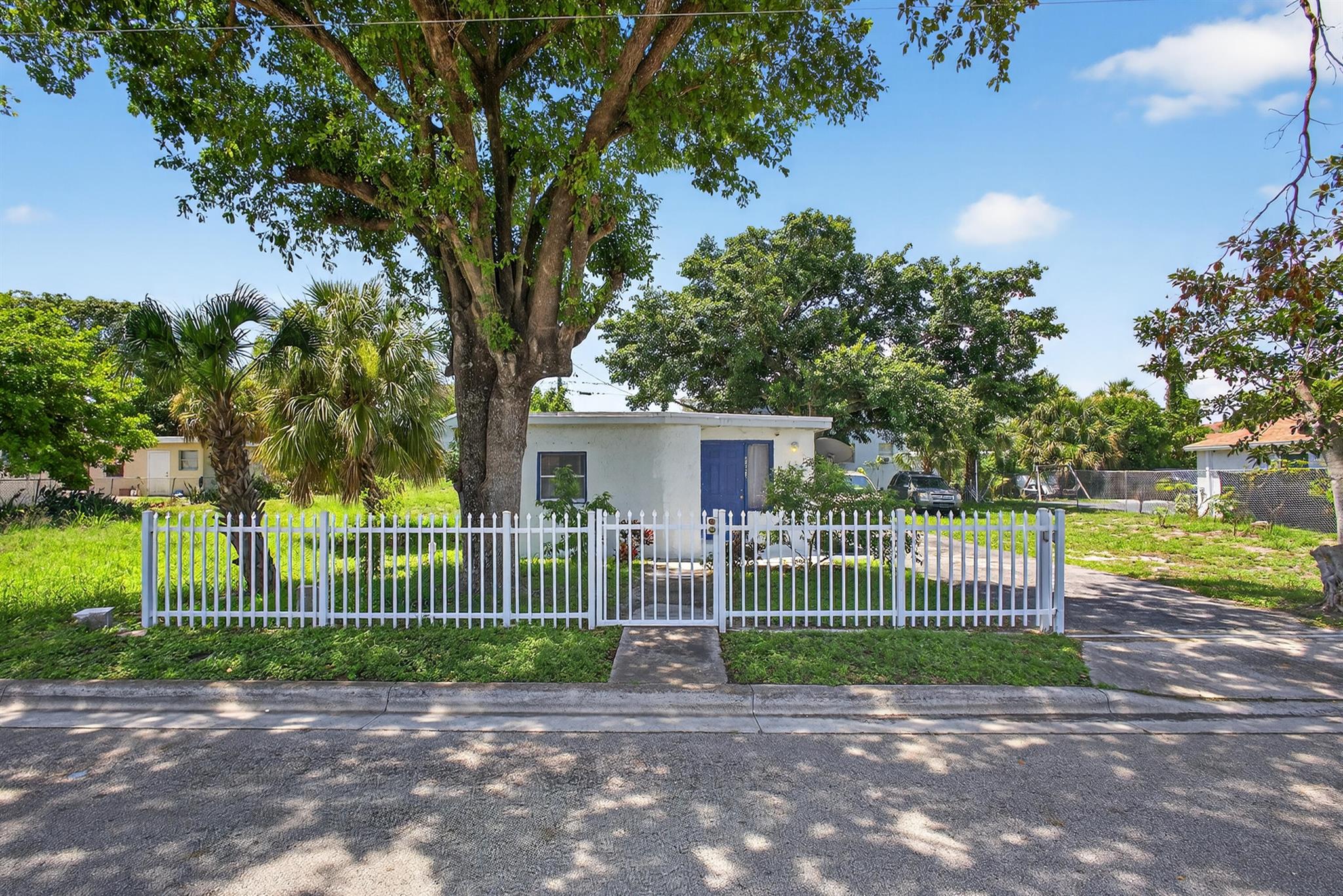Charming 2-bedroom, 1-bath home with a spacious yard offering endless potential--expand the footprint or create your own outdoor oasis. This property is perfect for investors or first-time buyers, with excellent rental potential in a high-demand area. Just minutes from the beautiful beaches of Singer Island and Palm Beach Shores, along with the world-famous Blue Heron Bridge, enjoy snorkeling, boating, and waterfront activities year-round. Conveniently located near grocery stores, restaurants, and major roadways for easy everyday living. With no HOA and a generous lot size, this home is a rare find in Riviera Beach. Don't miss this opportunity to own or invest in a vibrant coastal community!