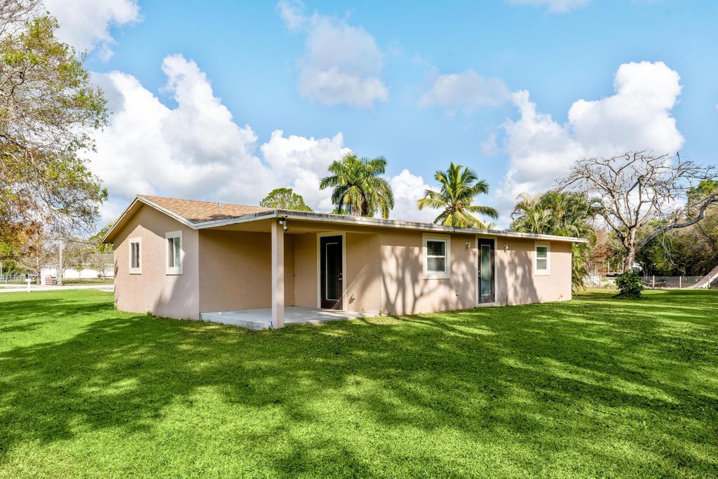 Photo of 6344 Grapeview Boulevard, Loxahatchee, FL 33470 (MLS # R11059628)