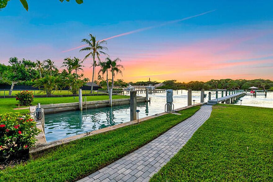 In the heart of Jupiter where coastal breezes carry decades of tradition, enjoy the Ultimate South Florida Lifestyle w/100 FEET of DIRECT INTRACOASTAL frontage in your backyard plus access to charming pathways that lead to the PRIVATE BEACHES of Jupiter Inlet Colony.   The turquoise waters are yours with private dock + basin to explore boating, snorkeling, fishing and simply watching the manatees, birds, and sea life. The open + light design offers spectacular SUNSET views overlooking the Intracoastal, the iconic Jupiter Lighthouse + Natural Area. This spacious 4-bedroom home features metal roof, large screened lanai w/pool, special architectural details, wonderful gathering spaces inside + out, plus a mature landscape w/avocado tree + mini banana grove on almost 1/2 an ACRE to give that extra Florida feel.  Whether you are looking for a classic escape or a foundation to build your dream home, this coveted location offers easy living just moments from dining, shops, and golf accessible by boat, car, or bike.  PBl Airport, Palm Beach, West Palm Beach being approx. 30 minutes away keeps you seamlessly connected to all that this remarkable South Florida region has to offer.