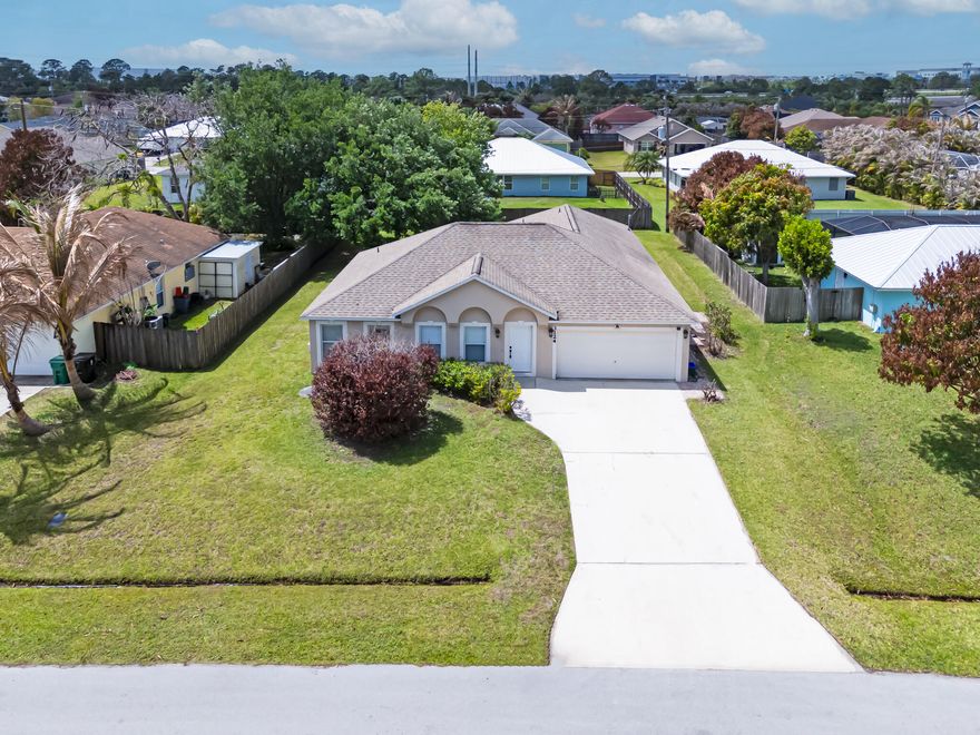Large & meticulously maintained 4/2/2 home with extended screen porch. centrally located off Rosser close to I-95, Tradition Sq, shopping & restaurants. This home features a newer roof, freshly painted interior, and a brand-new AC with over 2100 sq ft of living space with a nice open and flowing floor plan and tiled formal living, dining, large family with volume ceilings, and a galley kitchen with island and nice panty. The oversized master suite has newly installed luxury laminate flooring offering 2 walk-in closets & large a master bath with separate shower & roman tub. Guest bedrooms are spacious with newly installed laminate flooring, so much to offer. This affordable move-in ready gem has lots to offer and is priced to sell. There is no place like the comfort of your own​​‌​​​​‌​‌​​​‌‌​​​‌‌‌​​‌​​‌‌​​​​ home!