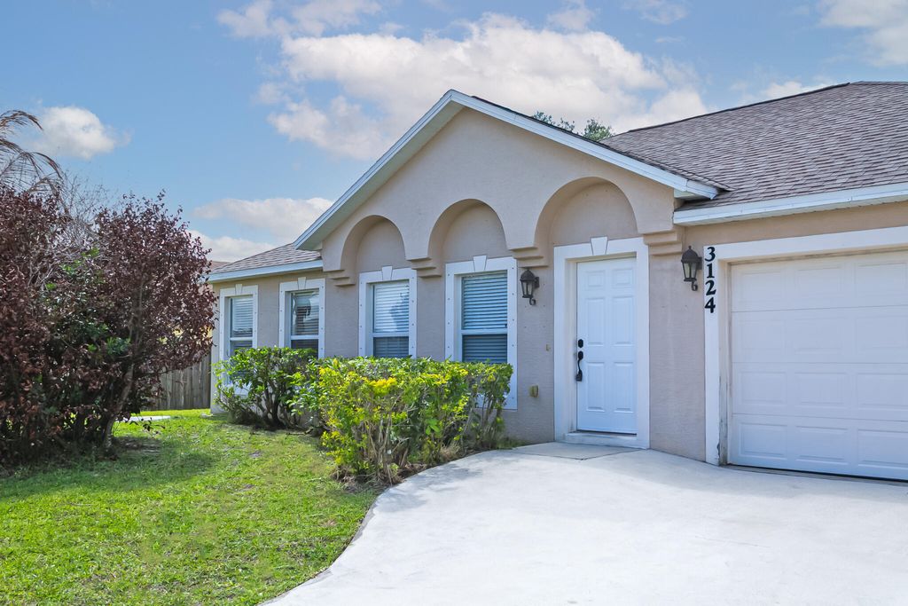 Photo of 3124 SW Armucher Street, Port Saint Lucie, FL 34953 (MLS # B26013738)