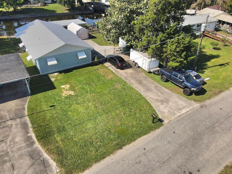 Welcome to your charming woodframe retreat nestled in one of Okeechobee's quietest, most peaceful neighborhoods! This beautifully renovated 2-bedroom, 2-bathroom gem boasts a reliable 2018 roof, efficient 2022 air conditioning, a brand new water heater, and all new major appliances throughout. Inside, you'll find a versatile dedicated office space and the modern convenience of an inside laundry room. Head outside to admire a gorgeous magnolia tree, a practical 10 by 10 storage shed, and a spacious screened-in boathouse perfect for unwinding by the water. With coveted Lake Okeechobee access and a private dock, waterfront living has never felt sweeter. Nearby shopping and conveniences make everyday life effortless. Schedule your showing today!