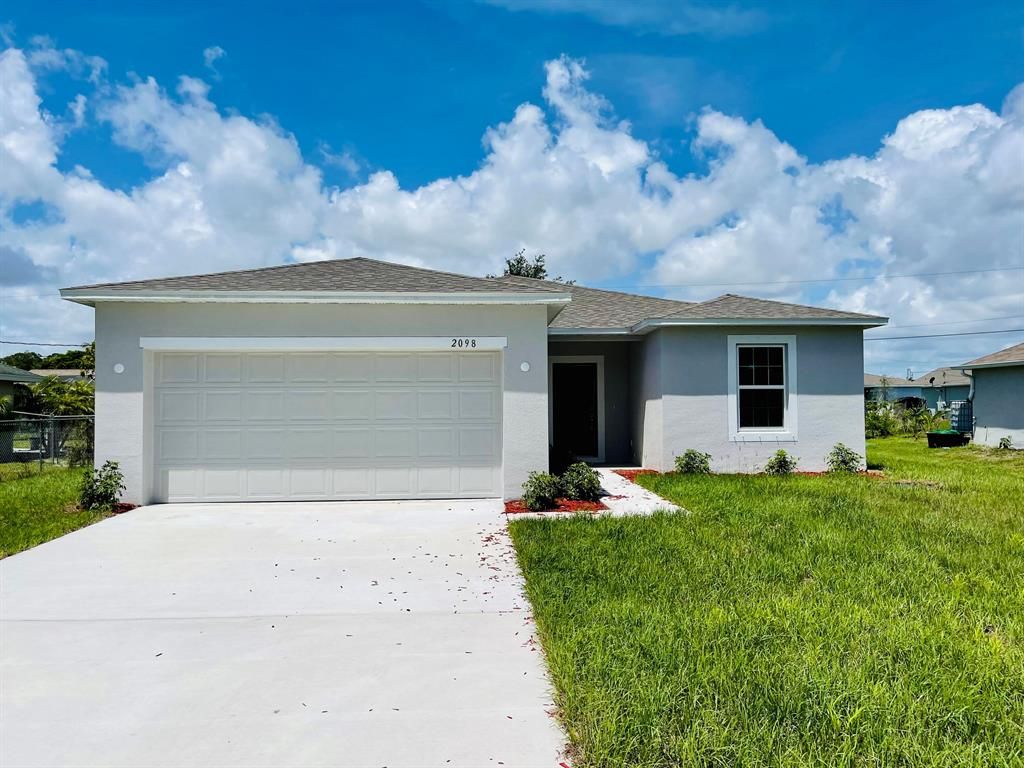 Photo of 2098 SW Burlington Street St, Port St Lucie, FL 34984 (MLS # R10803727)