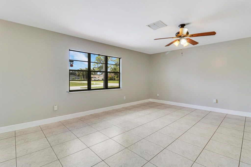 Photo of 1001 SE Spinnaker Avenue, Port Saint Lucie, FL 34983 (MLS # R10990559)