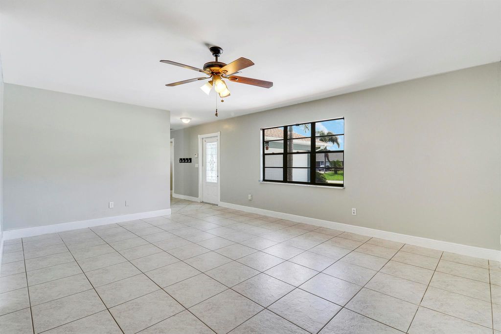 Photo of 1001 SE Spinnaker Avenue, Port Saint Lucie, FL 34983 (MLS # R10990559)