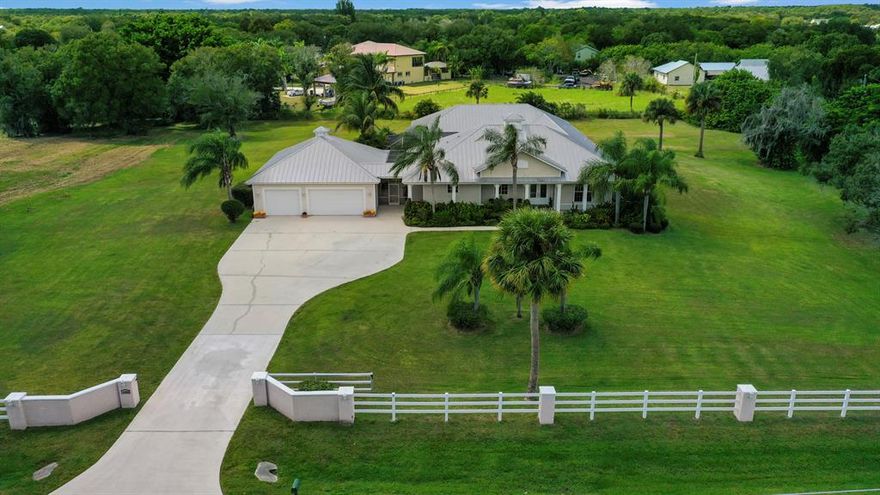 AMAZING 4.32 ACRE COUNTRY ESTATE with convenient, close to town location. This CUSTOM built 6BDRM/5.1BATH/3CG POOL HOME is the one you've been waiting for!  This luxury property features 2 inlaw/guest suites w/separate entry - perfect for multi-generational living!  Many features include wood-look tile flooring, IMPACT GLASS windows, LED lighting, & central vac. GOURMET KITCHEN with wood cabinetry, granite counters, center island, under-cabinet lighting, SS appliances including newer gas range plus a walk-in pantry! Enjoy entertaining in your huge games room w/bar, film projector, custom built-ins & walk-in refrigerator. Pocketing sliders lead out to LAGOON STYLE salt water pool & spa complete w/rock waterfall & waterslide!! Relax in your very own sauna! Call to view this COUNTRY RETREAT!